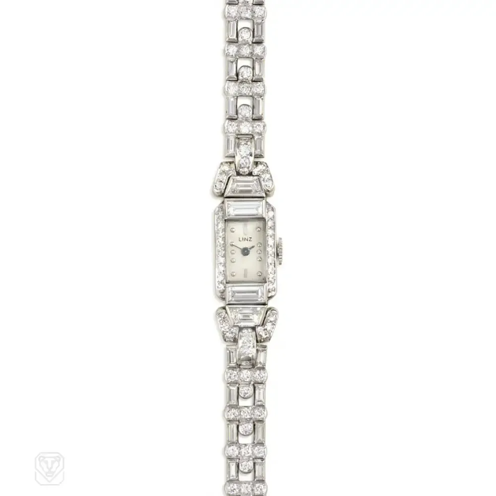 A diamond bracelet watch with geometric links, set with roun...