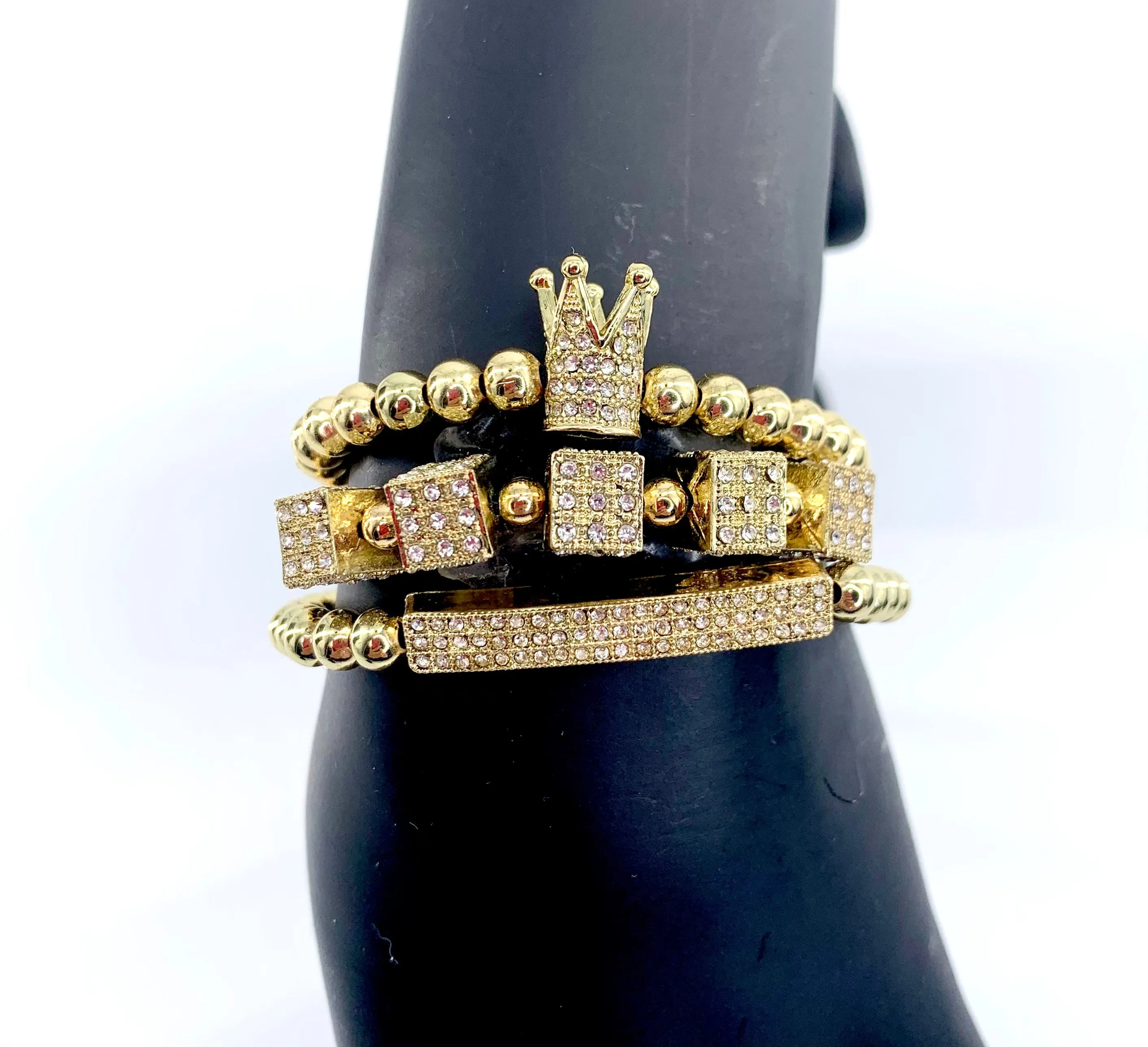 Gold king’s crown and dice charms bracelet set