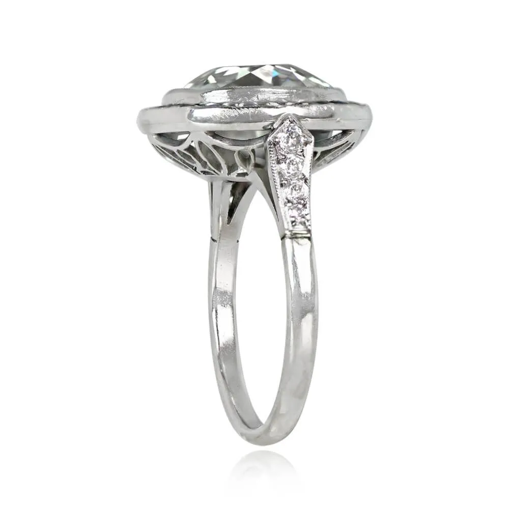 Platinum European cut Diamond and Emerald Halo set Ring